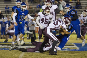 Mount Ida LIons Hunter Davis runs the ball